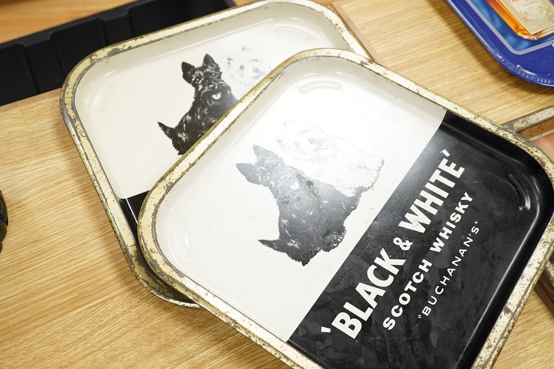 Five 1960s pub advertising trays for Scotch Whisky to include Johnnie Walker and Black & White, Buchanans, 35cm wide